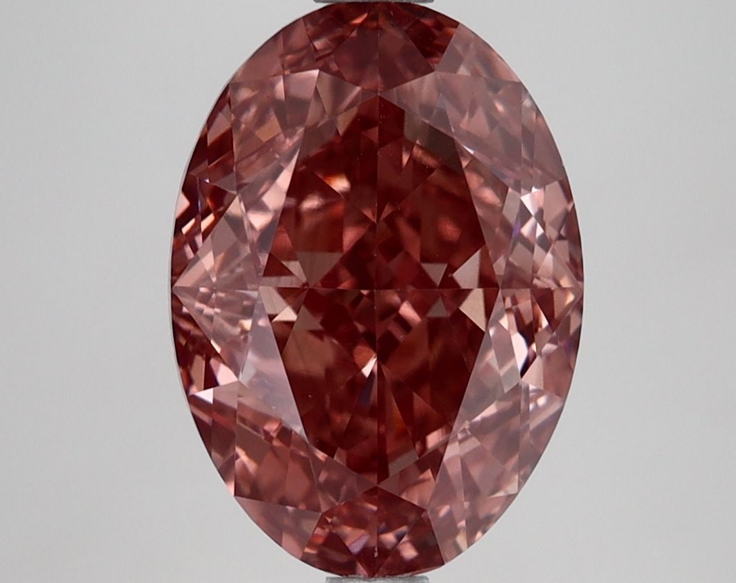 Loose Lab Diamond IGI Oval 3.87ct Fancy Vivid Brownish Pink VVS2: Loose Lab Diamond IGI Oval 3.87ct Fancy Vivid Brownish Pink VVS2 Loose lab-grown diamond, IGI certified, weighing 3.87ct with an oval cut, color Fancy Vivid Brownish Pink, clarity VVS2, and measures 1