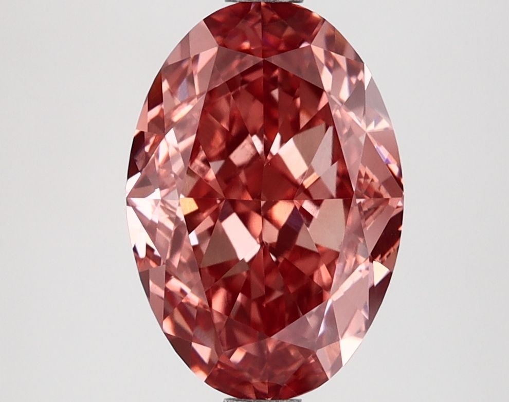 Loose Lab Diamond IGI Oval 3.1ct Fancy Vivid Brownish Pink VVS2: Loose Lab Diamond IGI Oval 3.1ct Fancy Vivid Brownish Pink VVS2 This 3.1ct Loose Lab Diamond, certified by IGI, showcases an oval cut with Fancy Vivid Brownish Pink color and VVS2 clarity, featuring e
