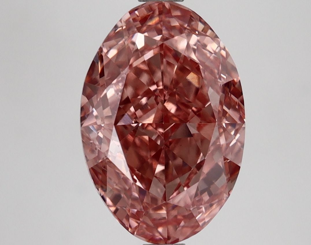 Loose Lab Diamond IGI Oval 3.42ct Fancy Vivid Brownish Pink VS1: Loose Lab Diamond IGI Oval 3.42ct Fancy Vivid Brownish Pink VS1 Loose lab-grown diamond IGI certified, weighing 3.42ct with an oval cut, fancy vivid brownish pink color, clarity VS1, and excellent pol