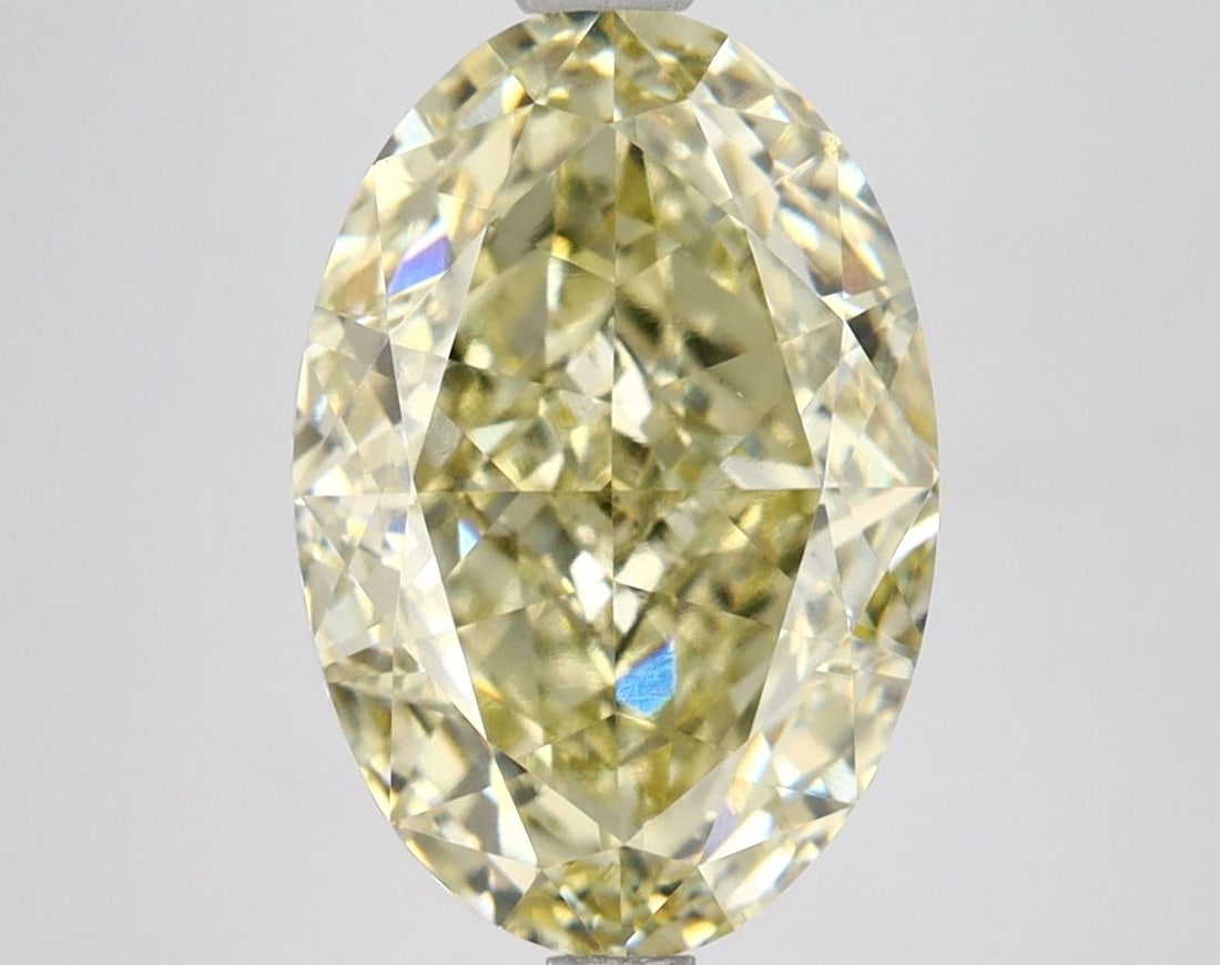 Loose Lab Diamond IGI Oval 4.5ct Fancy Yellow VVS2: Loose Lab Diamond IGI Oval 4.5ct Fancy Yellow VVS2 Loose lab-grown diamond weighing 4.5ct, featuring a fancy yellow color and VVS2 clarity, certified by IGI. The diamond has excellent polish and symme