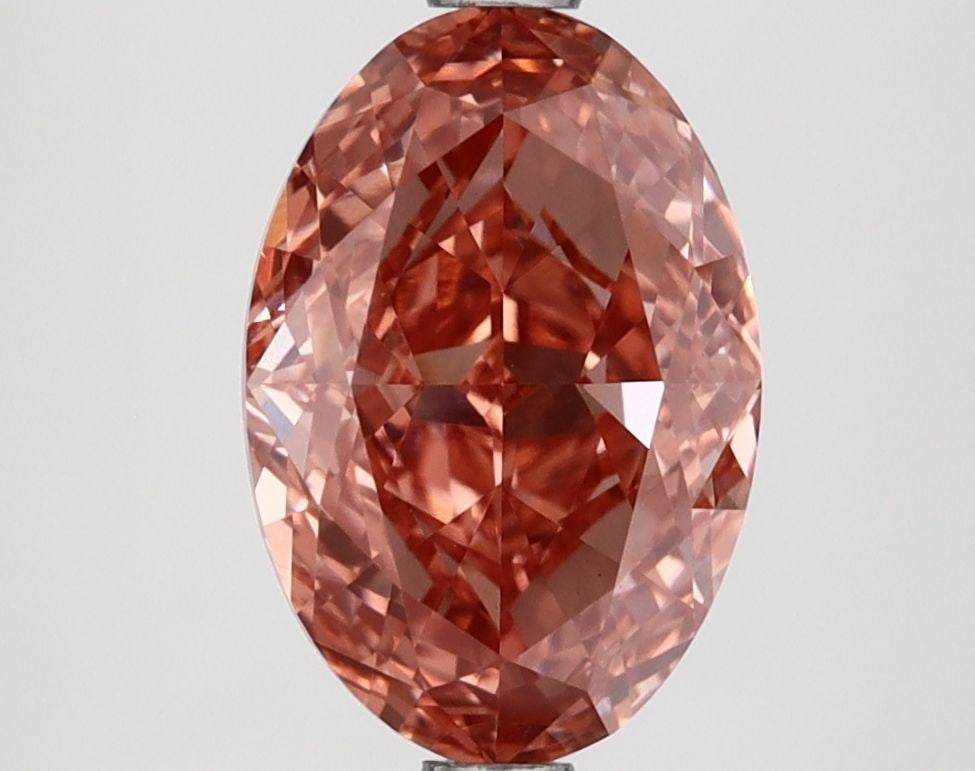 Loose Lab Diamond IGI Oval 2.64ct Fancy Vivid Brownish Pink VVS2: Loose Lab Diamond IGI Oval 2.64ct Fancy Vivid Brownish Pink VVS2 Loose lab-grown diamond weighing 2.64ct, oval cut, Fancy Vivid Brownish Pink color, VVS2 clarity, and measurements of 10.52L x 7.11W x