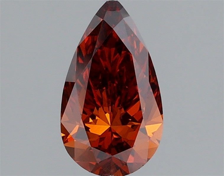 Loose Lab Diamond IGI Pear 1.0ct Fancy Vivid Orange VVS2: Loose Lab Diamond IGI Pear 1.0ct Fancy Vivid Orange VVS2 Loose Lab Diamond IGI Pear, 1.0ct, Fancy Vivid Orange color, VVS2 clarity, with VG polish and symmetry, measuring 9.5L x 5.37W x 3.45H, certifi