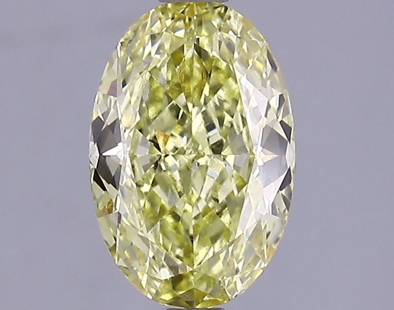 Loose Lab Diamond IGI Oval 1.51ct Fancy Vivid Yellow VVS2: Loose Lab Diamond IGI Oval 1.51ct Fancy Vivid Yellow VVS2 Loose Lab Diamond IGI Oval 1.51ct Fancy Vivid Yellow VVS2, with a fancy vivid yellow color and VVS2 clarity, measuring 9.21L x 6.11W x 3.56H,