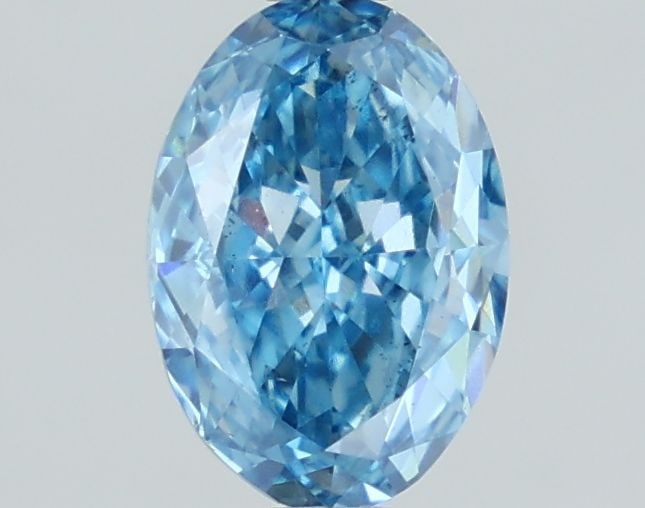 Loose Lab Diamond 1.23ct Fancy Vivid Blue VS2 - IGI Oval: Loose Lab Diamond 1.23ct Fancy Vivid Blue VS2 - IGI Oval Loose lab diamond weighing 1.23ct, cut in an oval style, with fancy vivid blue color and VS2 clarity. Certified by IGI, it measures 8.14L x 5.6