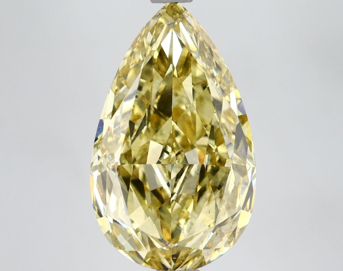 Loose Lab Diamond IGI Pear 4.5ct Fancy Vivid Yellow VS2: Loose Lab Diamond IGI Pear 4.5ct Fancy Vivid Yellow VS2 The 4.5ct loose lab-grown pear diamond exhibits a Fancy Vivid Yellow color and VS2 clarity, certified by IGI, with excellent polish and very goo