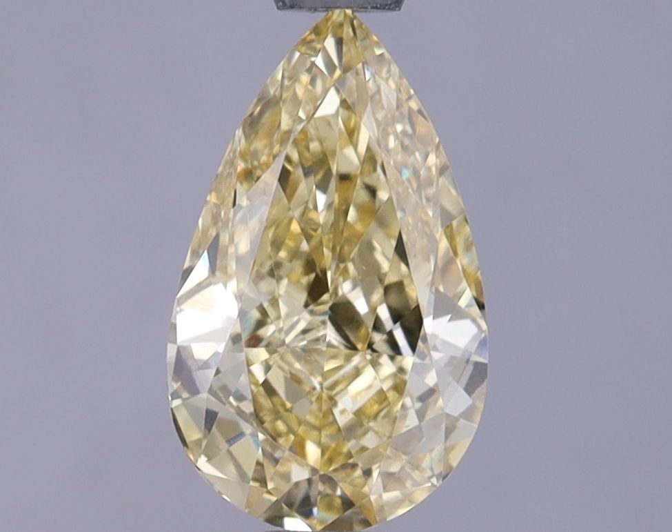 Loose Lab Diamond IGI Pear 1.02ct Fancy Vivid Yellow VS1: Loose Lab Diamond IGI Pear 1.02ct Fancy Vivid Yellow VS1 Loose lab-grown diamond weighing 1.02ct, color Fancy Vivid Yellow, clarity VS1, with measurements of 8.8L x 5.34W x 3.3H, certified by IGI. Ite