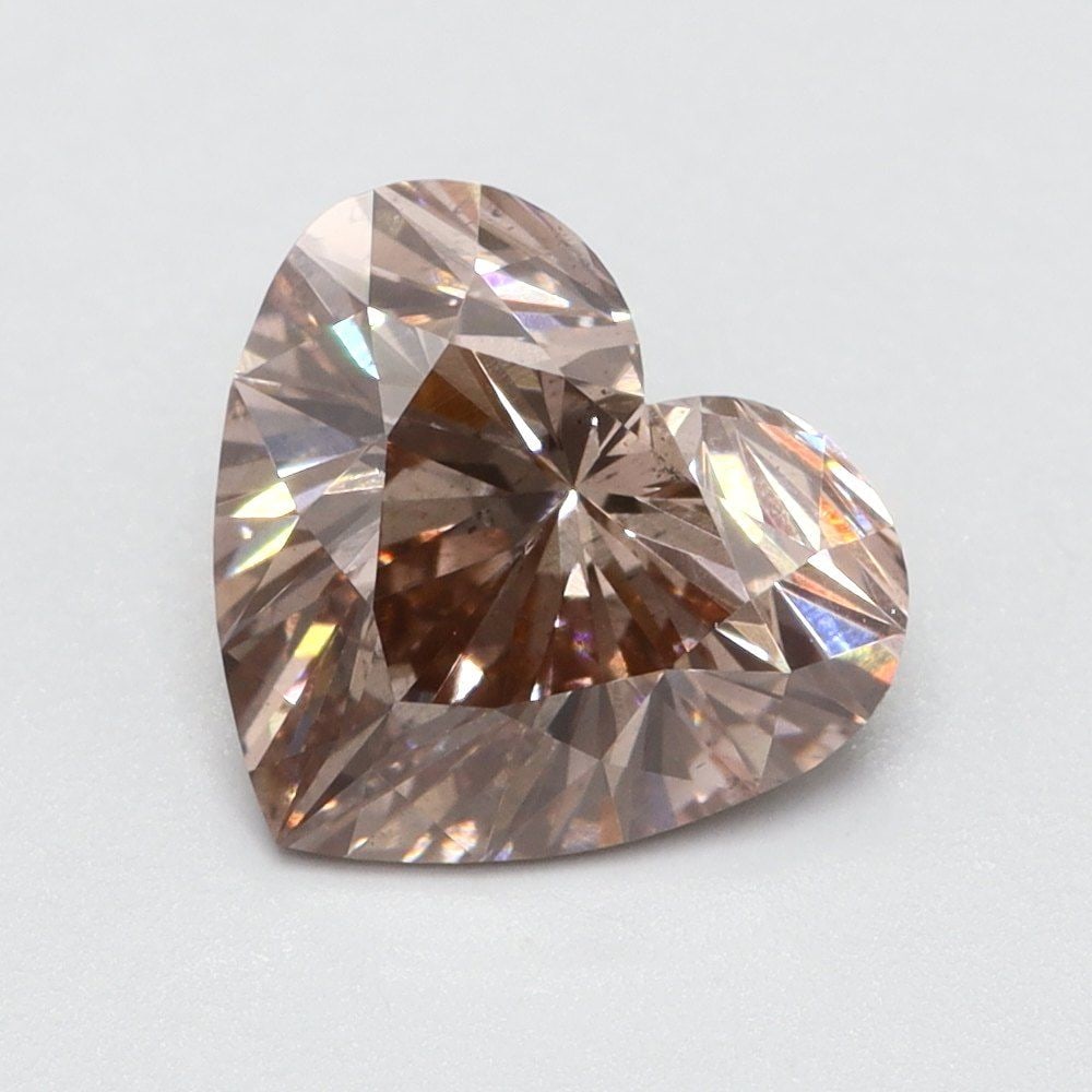Loose Lab Diamond Heart 1.02ct Fancy Vivid Brownish Pink SI1: Loose Lab Diamond Heart 1.02ct Fancy Vivid Brownish Pink SI1 Loose Lab Diamond Heart, 1.02ct, Fancy Vivid Brownish Pink, Clarity SI1, with Very Good Polish and Symmetry. No certification. Item Specifi