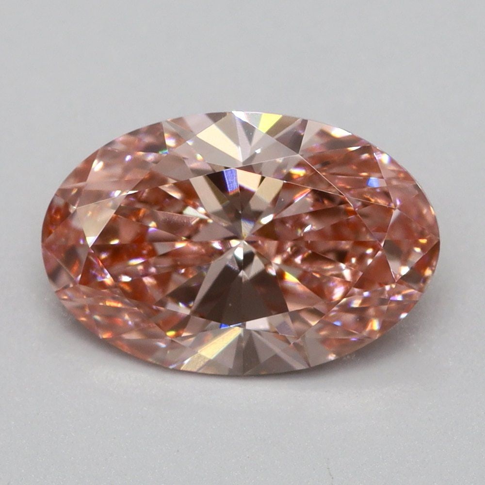Loose Lab Diamond 1.01ct Fancy Vivid Pink VS1 - Oval: Loose Lab Diamond 1.01ct Fancy Vivid Pink VS1 - Oval Loose lab-grown oval diamond of 1.01ct, featuring fancy vivid pink color and VS1 clarity, with dimensions of 8.4L x 5.6W x 3.4H mm, certification n