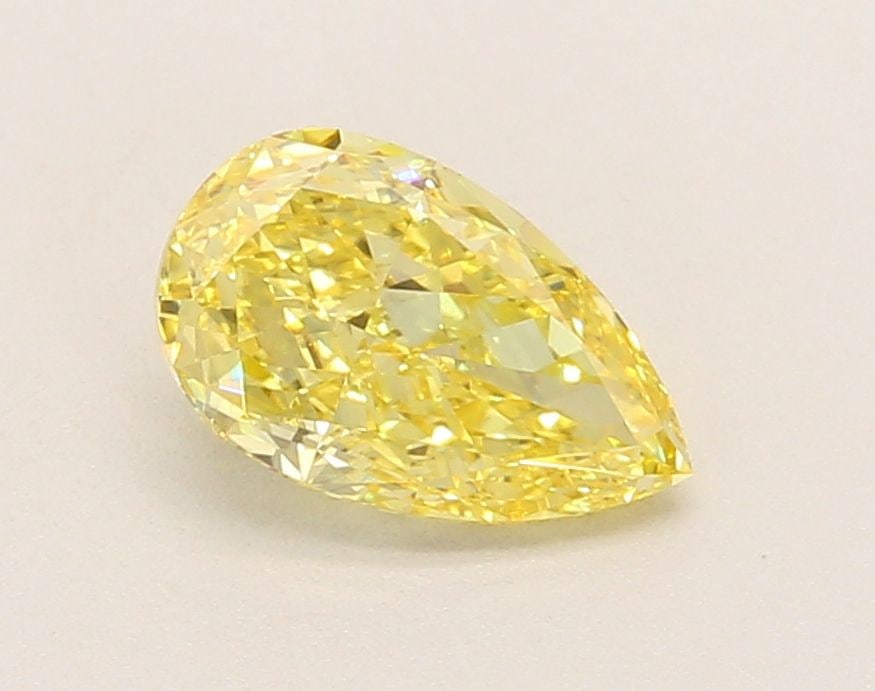 Loose Lab Diamond 1.35ct Fancy Vivid Yellow VVS2 - IGI Pear: Loose Lab Diamond 1.35ct Fancy Vivid Yellow VVS2 - IGI Pear Loose Lab Diamond IGI Pear, weighing 1.35 carats, features a color of Fancy Vivid Yellow and a clarity of VVS2; it measures 9.2L x 5.63W x