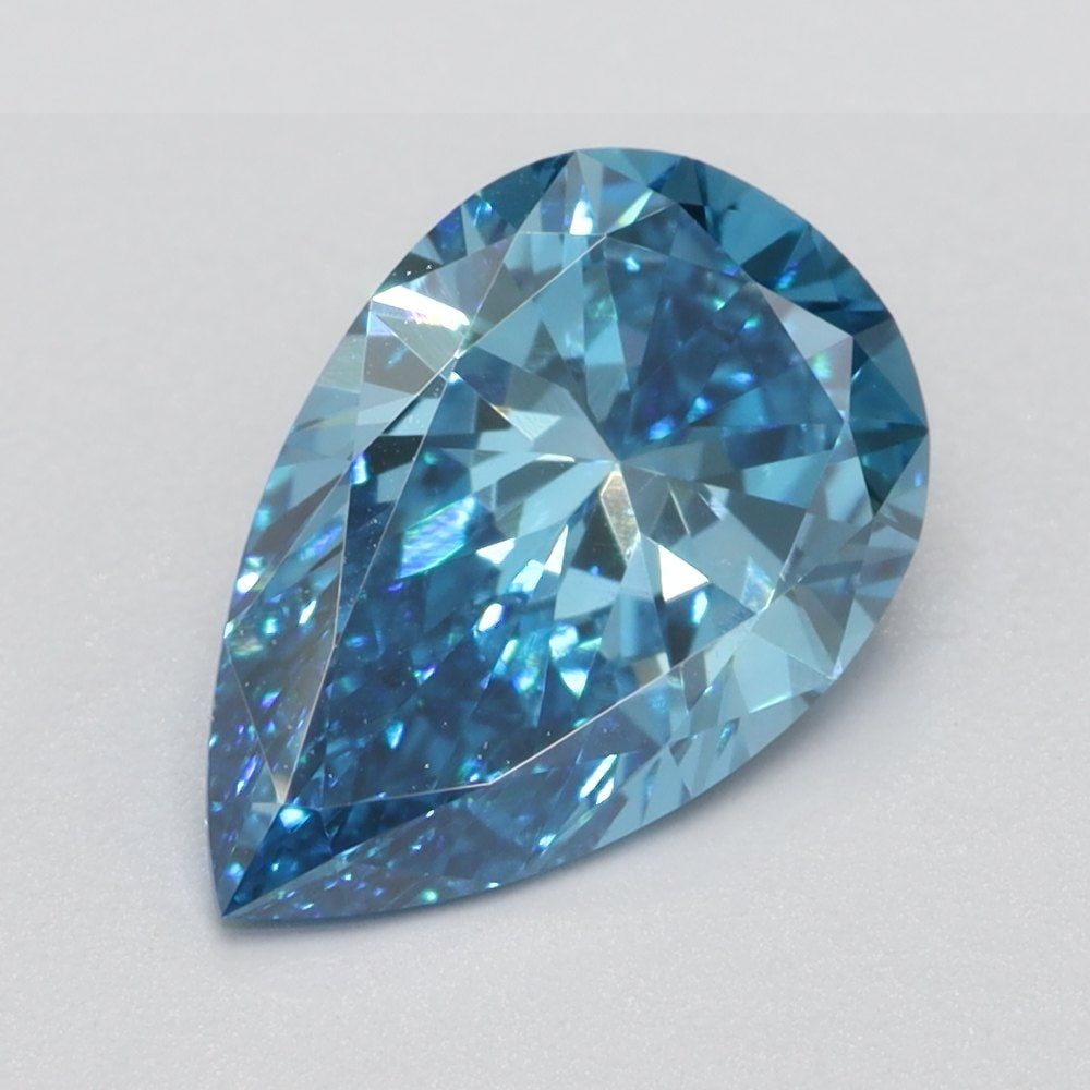 Loose Lab Diamond 1.0ct Pear Fancy Vivid Blue VS2: Loose Lab Diamond 1.0ct Pear Fancy Vivid Blue VS2 Loose Lab Diamond weighing 1.0ct, Pear cut, Fancy Vivid Blue color, clarity VS2, with no certification. Measurements are 8.62L x 5.64W x 3.4H. Item Sp