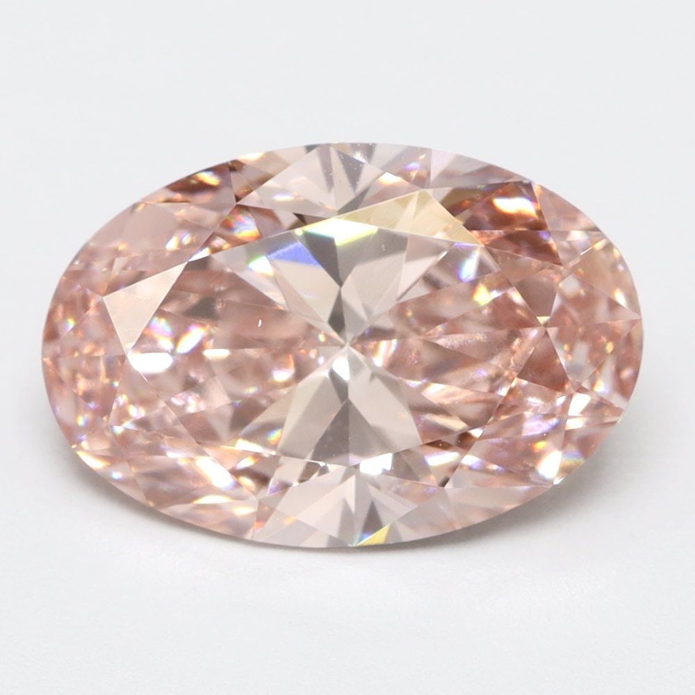 Loose Lab Diamond Oval 1.57ct Fancy Vivid Pink VS1: Loose Lab Diamond Oval 1.57ct Fancy Vivid Pink VS1 Loose Lab Diamond of 1.57ct, Oval cut, exhibiting Fancy Vivid Pink color and VS1 clarity. No certification, measurements are 9.72L X 6.5W X 3.85H. It