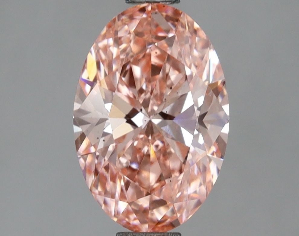 Loose Lab Diamond IGI Oval 1.52ct Fancy Vivid Pink VS2: Loose Lab Diamond IGI Oval 1.52ct Fancy Vivid Pink VS2 This 1.52ct loose lab diamond in an oval cut has a fancy vivid pink color and VS2 clarity, featuring excellent polish and symmetry, certified by