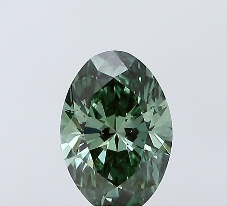 Loose Lab Diamond 1.0ct Fancy Vivid Green VS1 - IGI Oval: Loose Lab Diamond 1.0ct Fancy Vivid Green VS1 - IGI Oval Loose lab diamond weighing 1.0ct, with a color grade of Fancy Vivid Green and clarity VS1. It is IGI certified and features EX polish and symme