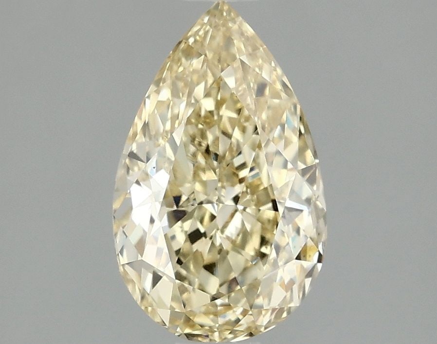 Loose Lab Diamond Pear 1.49ct Fancy Yellow VS1: Loose Lab Diamond Pear 1.49ct Fancy Yellow VS1 Loose Lab Diamond Pear weighing 1.49ct, fancy yellow color, clarity VS1, with excellent polish and symmetry. Certification is not provided, measures 9.5L