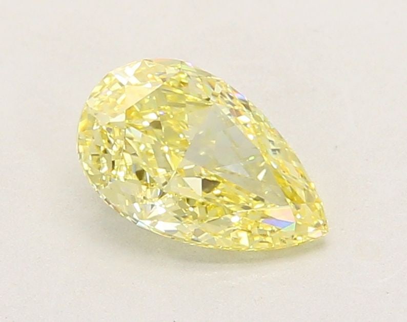 Loose Lab Diamond IGI Pear 1.26ct Fancy Intense Yellow VVS2: Loose Lab Diamond IGI Pear 1.26ct Fancy Intense Yellow VVS2 Loose Lab Diamond IGI Pear, 1.26ct, featuring Fancy Intense Yellow color and VVS2 clarity, excellent polish and symmetry, certified by IGI.