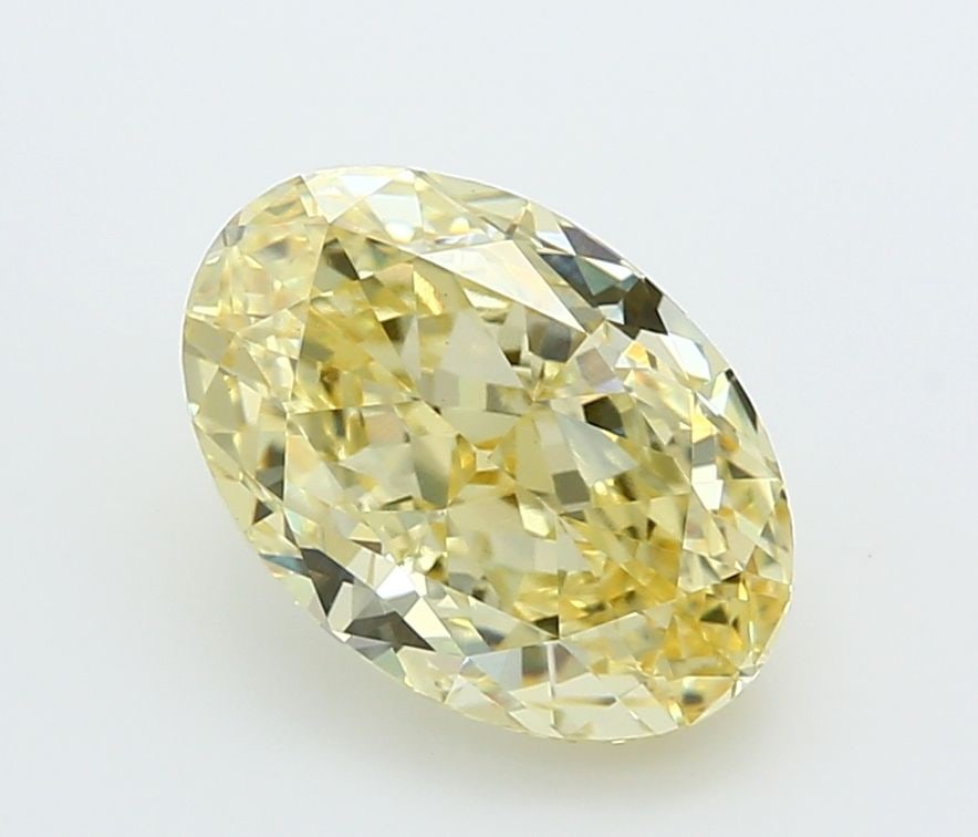 Loose Lab Diamond IGI Oval 3.05ct Fancy Yellow VVS2: Loose Lab Diamond IGI Oval 3.05ct Fancy Yellow VVS2 Loose lab-created diamond, IGI certified, weighing 3.05ct with an oval cut; fancy yellow color, clarity VVS2, measurements 10.85L x 7.44W x 4.87H. I