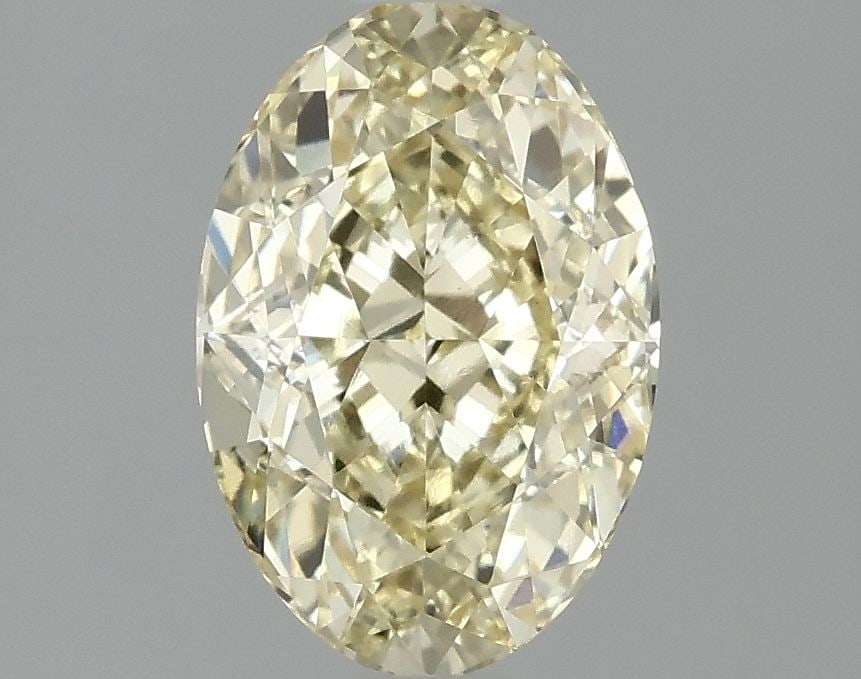 1.59ct Oval Fancy Yellow VS1 - Loose Lab Diamond: 1.59ct Oval Fancy Yellow VS1 - Loose Lab Diamond Loose lab-grown diamond weighing 1.59ct with an oval cut, fancy yellow color, VS1 clarity, and no certification. Measurements are 8.73L x 5.94W x 3.99H