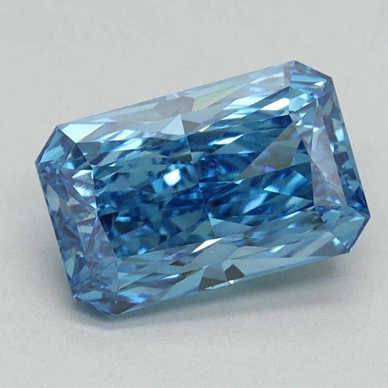 Loose Lab Diamond IGI Radiant 1.55ct Fancy Vivid Blue VS1: Loose Lab Diamond IGI Radiant 1.55ct Fancy Vivid Blue VS1 Loose lab-grown diamond at 1.55 carats, radiant cut, Fancy Vivid Blue color, VS1 clarity, excellent polish and symmetry, certified by IGI. Mea