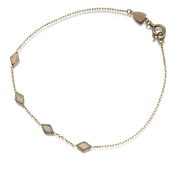 Agete 4P Opal Bracelet 10K Yellow Gold: Agete 4P Opal Bracelet 10K Yellow Gold Agete bracelet made of 10k yellow gold, featuring natural opals, sourced from Japan. Item Specifics: Materials Sourced From: Japan Brand: agete Metal: Yellow Gol