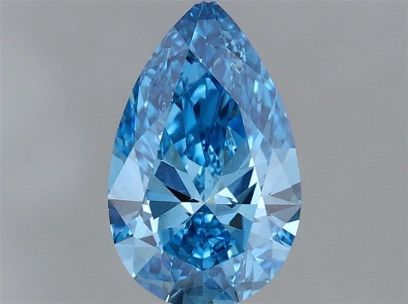 Loose Lab Diamond IGI Pear 1.01ct Fancy Vivid Blue VS2: Loose Lab Diamond IGI Pear 1.01ct Fancy Vivid Blue VS2 Loose lab-grown pear diamond weighing 1.01 carats, IGI certified, in Fancy Vivid Blue color with VS2 clarity. Measurements are 9.04L x 5.56W x 3.