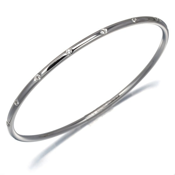 Tiffany&Co. 18K 750 White Gold Diamond Bezet Bangle Bracelet: Tiffany&Co. 18K 750 White Gold Diamond Bezet Bangle Bracelet Tiffany&Co. Bangle Bracelet in 18K white gold featuring a natural diamond, originating from Italy. Item Specifics: Country Of Origin: Italy