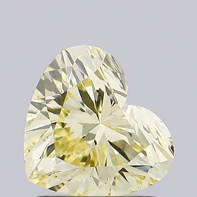 Loose Lab Diamond IGI Heart 1.11ct Fancy Yellow VS1: Loose Lab Diamond IGI Heart 1.11ct Fancy Yellow VS1 Loose lab-grown diamond certified by IGI, weighing 1.11ct, fancy yellow color, and VS1 clarity. Measurements are 6.32L x 7.19W x 4.19H. Item