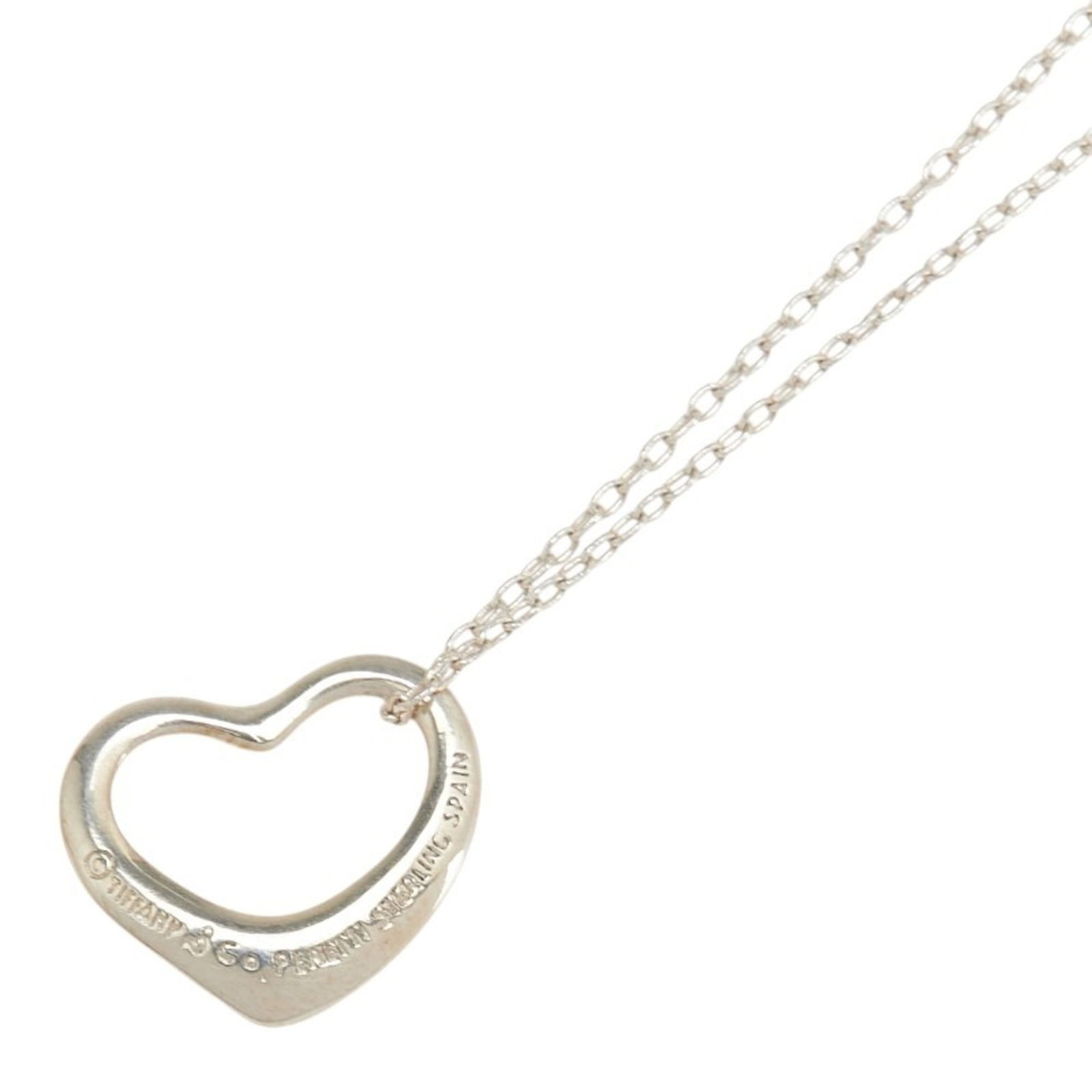 Tiffany & Co. Open Heart Necklace in 925 Silver for Women: Tiffany & Co. Open Heart Necklace in 925 Silver for Women Tiffany & Co. women's open heart necklace crafted from 925 silver, with a neck circumference of 45 cm and a pendant size of 12.3mm x 14.7mm. T
