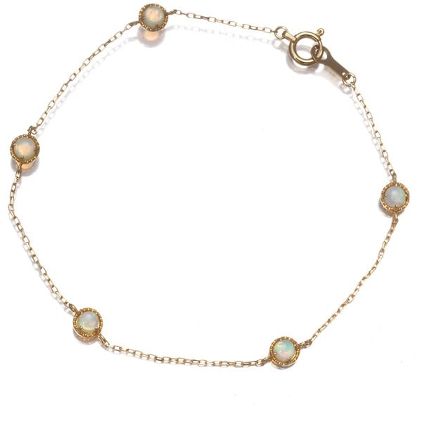 Gold Ete Bracelet Opal Station 18K 750 Yellow: Gold Ete Bracelet Opal Station 18K 750 Yellow This listing features Gold Ete Bracelet Opal Station 18K 750 Yellow. Item specifics are provided below. Item Specifics: Country Of Origin: Japan Brand: et