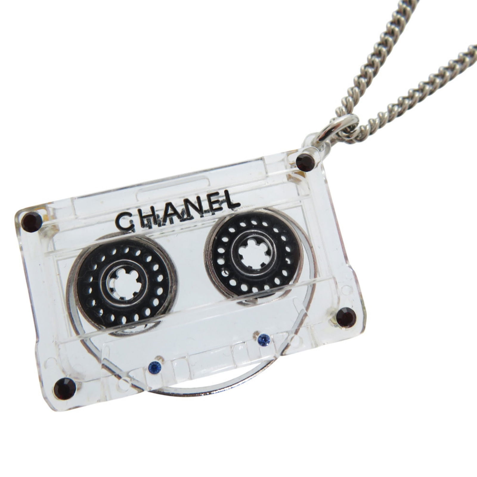 CHANEL Rhinestone Necklace Cassette Tape 1434, Clear Plastic: CHANEL Rhinestone Necklace Cassette Tape 1434, Clear Plastic This Chanel necklace, styled as a cassette tape, is made from clear plastic and adorned with rhinestones in blue, clear, and red colors,
