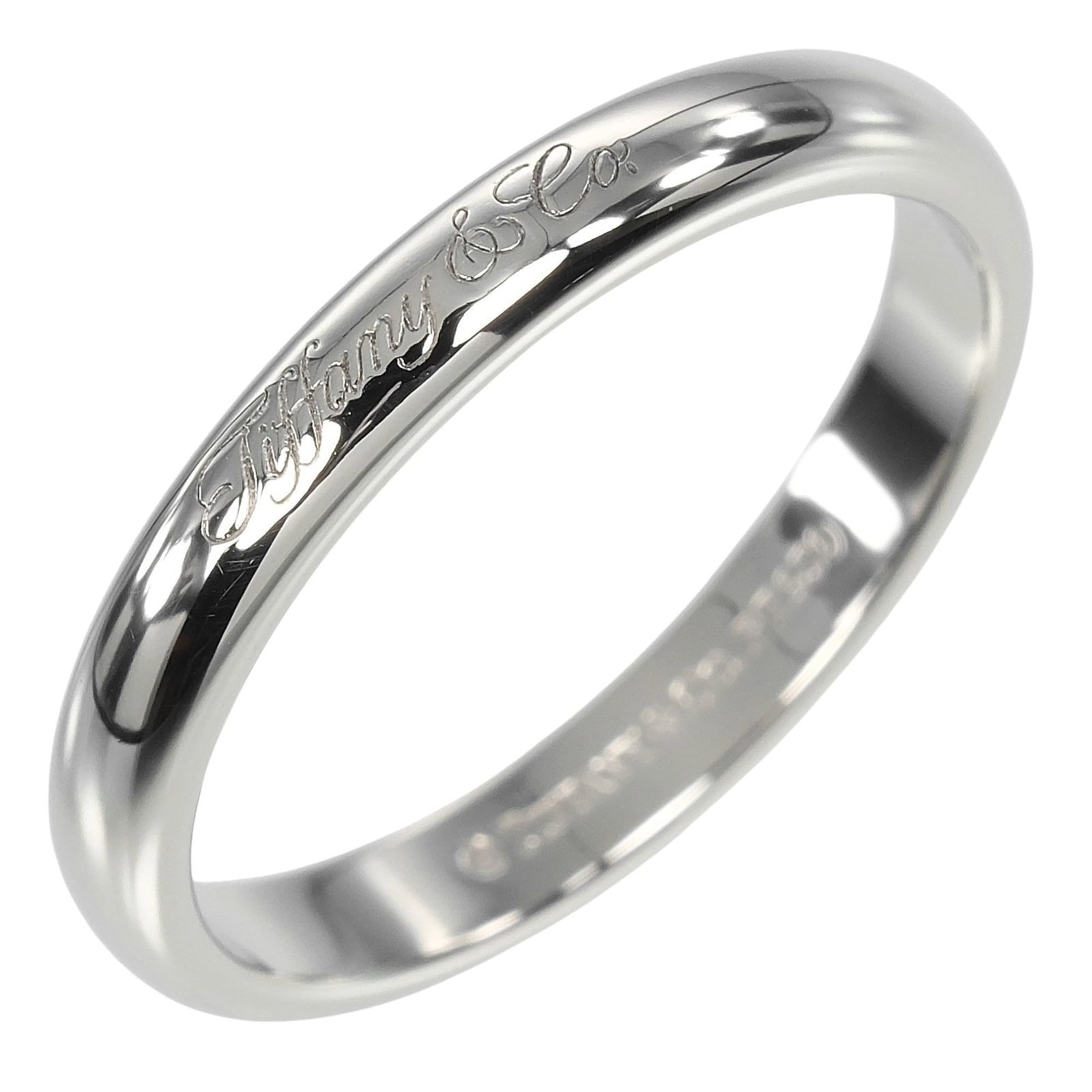 Platinum 950 Tiffany Band Ring: Platinum 950 Tiffany Band Ring This Tiffany band ring is made of 950 platinum and is designed for women, size 7, in used but like-new condition with hardly any traces of usage. Item Specifics: Brand: