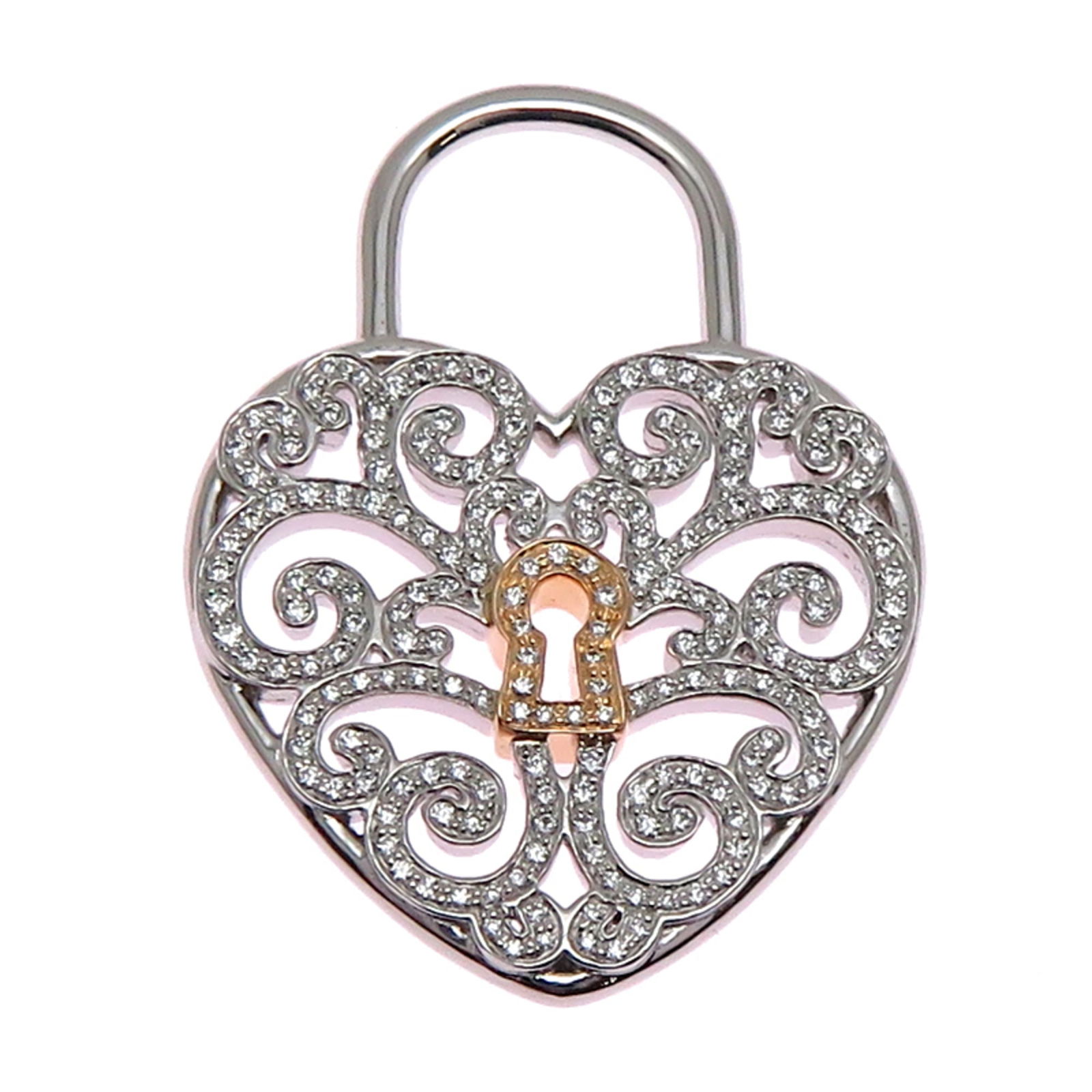 Tiffany Enchant Heart Pendant Women's Pt950 Platinum: Tiffany Enchant Heart Pendant Women's Pt950 Platinum Tiffany Enchant Heart pendant in platinum 950 and 18K pink gold with a diamond, measuring 29mm x 22mm, in very good used condition. Item