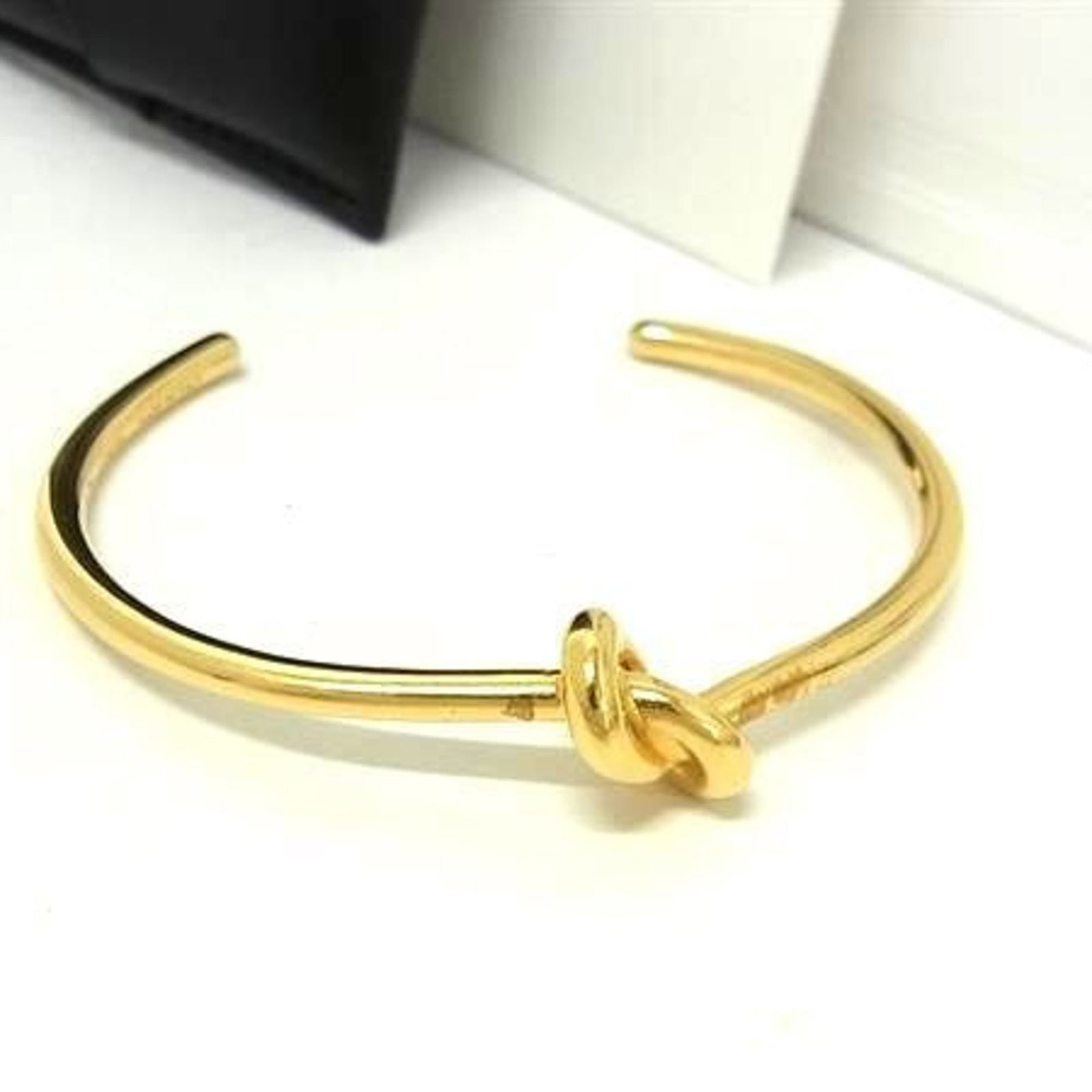 Celine Metal Charm Bracelet: Celine Metal Charm Bracelet Celine charm bracelet in gold metal, measuring 11.9cm in length, used in very good condition with minor signs of wear. Item Specifics: Brand: Celine Type: Charm Bracelet St