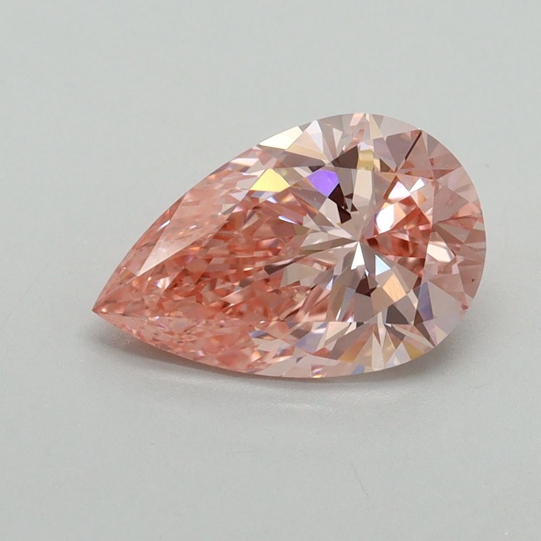 Loose Lab Diamond IGI Pear 1.79ct Fancy Vivid Pink VVS2: Loose Lab Diamond IGI Pear 1.79ct Fancy Vivid Pink VVS2 Loose IGI certified Lab Diamond, 1.79ct, Fancy Vivid Pink, clarity VVS2, with dimensions of 10.8L x 6.9W x 4.19H, showcasing excellent polish an