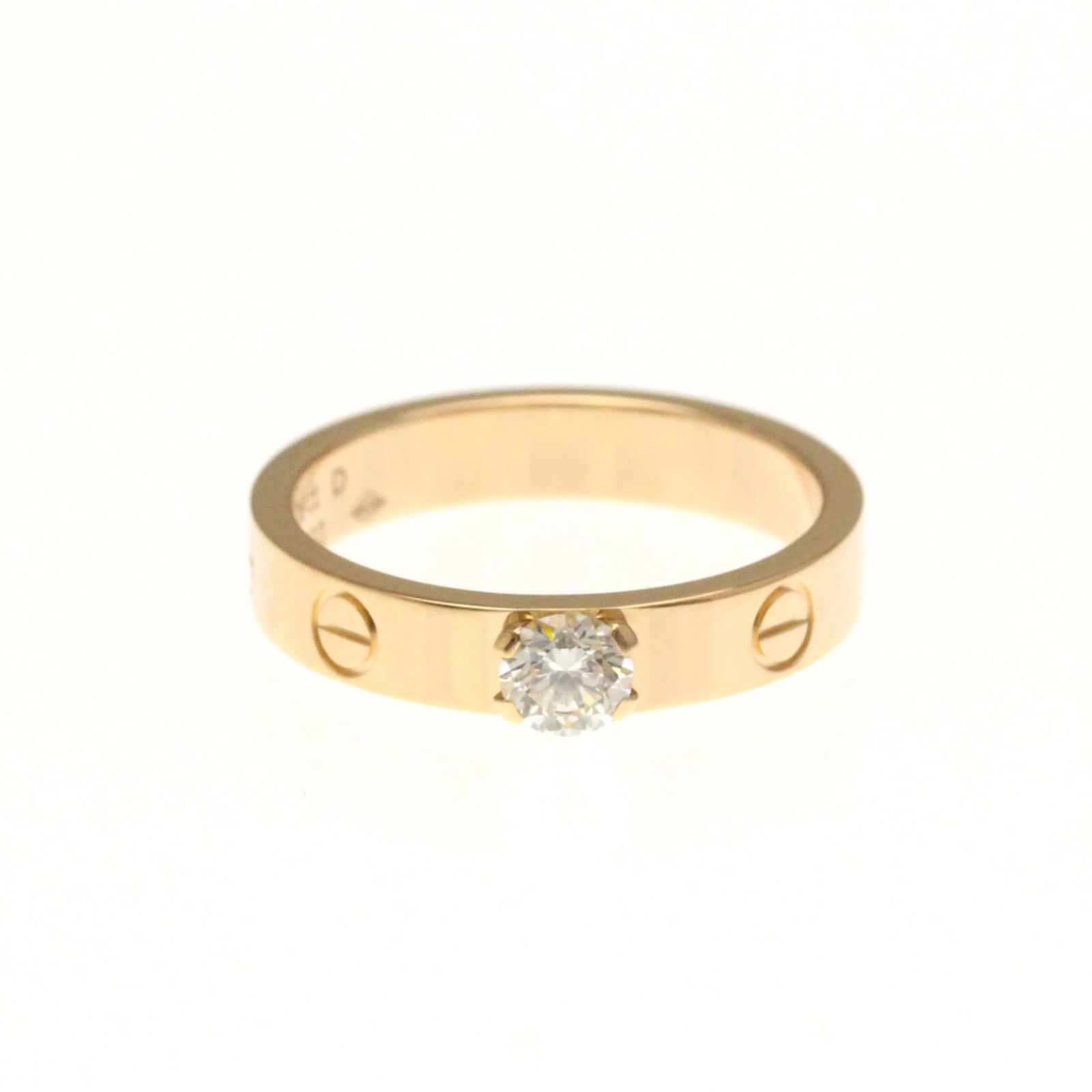 18K Pink Gold Cartier Band Ring: 18K Pink Gold Cartier Band Ring This 18K Pink Gold Cartier Band Ring features a 0.26 ct diamond rated F in color and VVS1 in clarity, with a width of 3.9mm and a US size of 6, presented in very good u