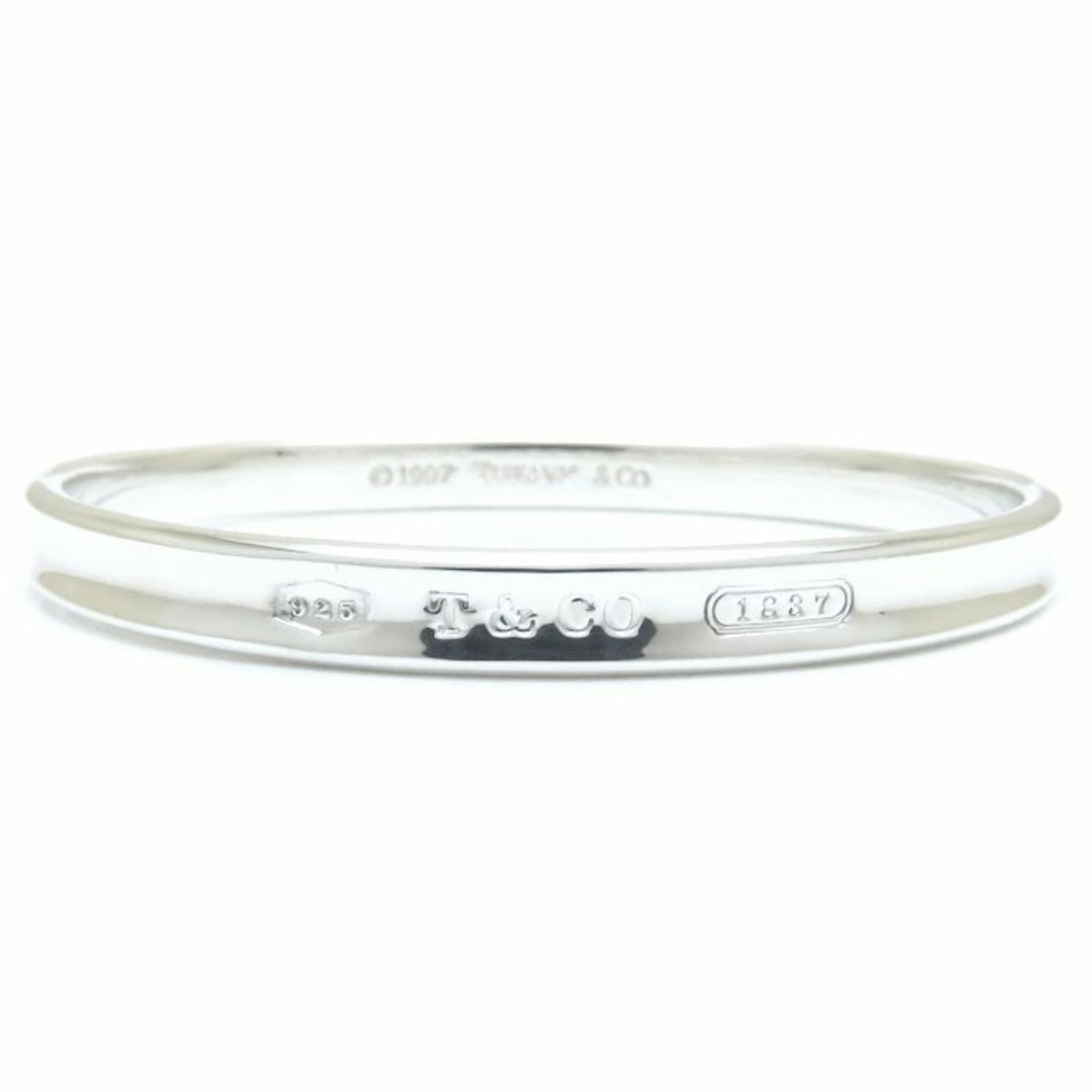 Silver 925 Tiffany Bangle: Silver 925 Tiffany Bangle Tiffany Silver 925 Bangle for women, length 19.5cm (7.67'') in very good used condition with minor scratches. Item Specifics: Brand: Tiffany Type: Bangle Gender: Women Materi