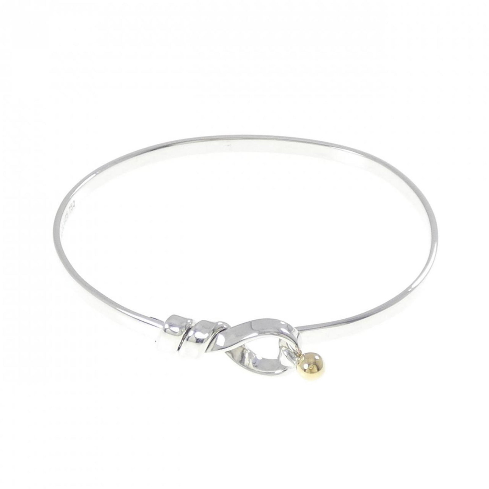 Tiffany Silver 925 Bangle with Yellow Gold (18K): Tiffany Silver 925 Bangle with Yellow Gold (18K) Tiffany Silver 925 Bangle with 18K Yellow Gold, weighing 16.5cm in length. Condition is like new with hardly any traces of usage. Item Specifics: Brand