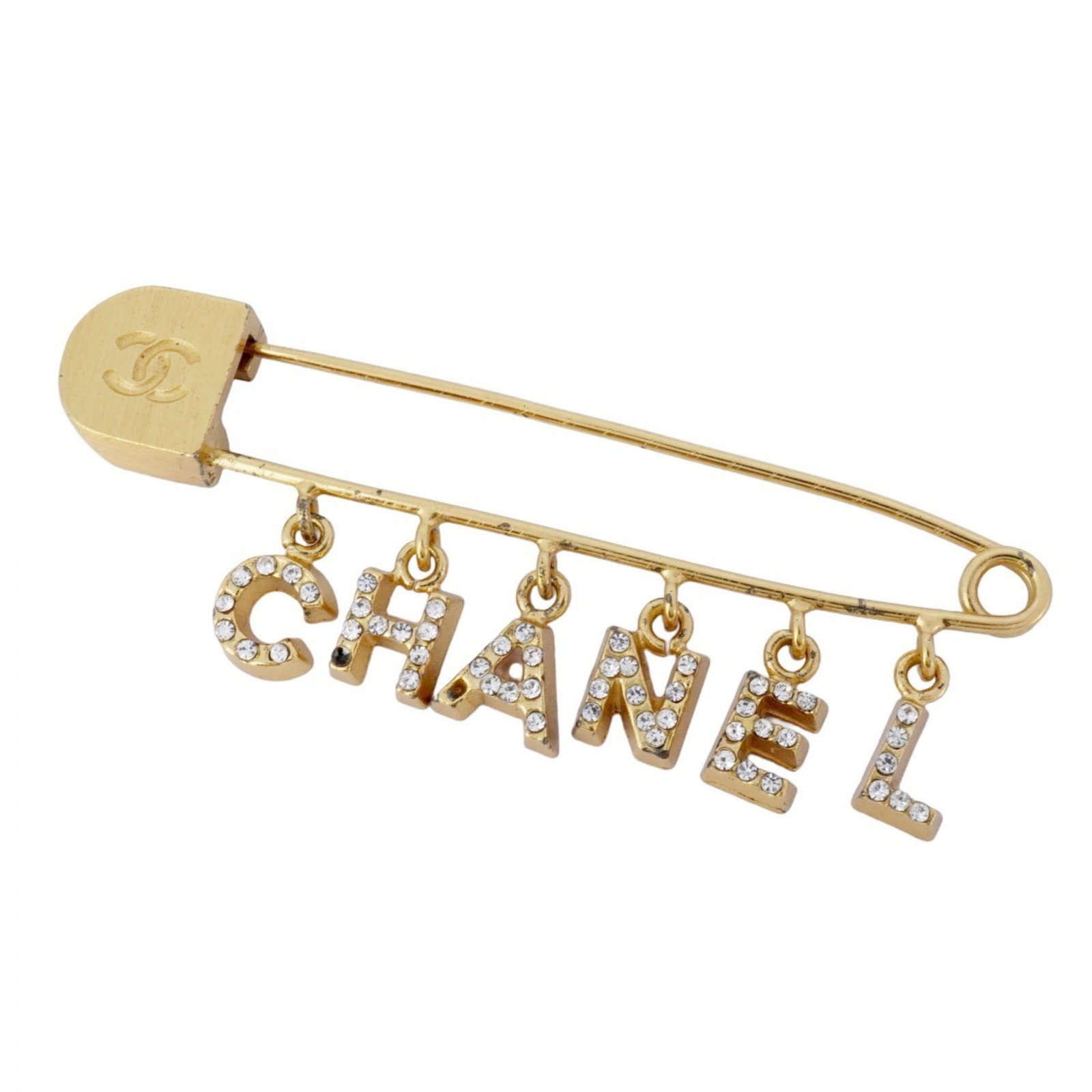 Plating Chanel Brooch Gold: Plating Chanel Brooch Gold Chanel gold-plated brooch adorned with rhinestones, measuring 1.96cm x 5.69cm, in acceptable condition with visible traces of usage. Item Specifics: Brand: Chanel Type: Broo