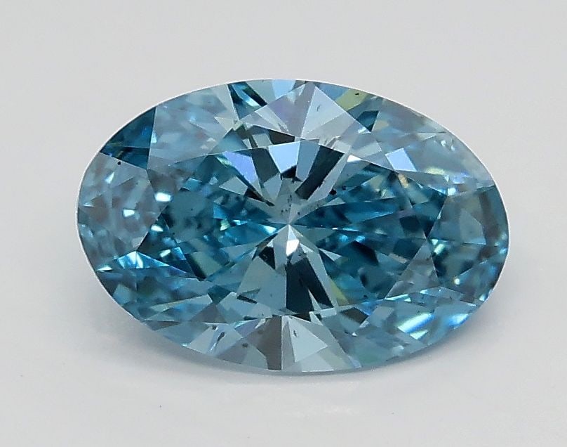 Loose Lab Diamond 1.02ct Fancy Vivid Blue VS2 - IGI Oval: Loose Lab Diamond 1.02ct Fancy Vivid Blue VS2 - IGI Oval Loose lab-grown diamond weighing 1.0ct with a Fancy Vivid Pink color grade and VVS2 clarity, certified by IGI. The diamond has VG polish and