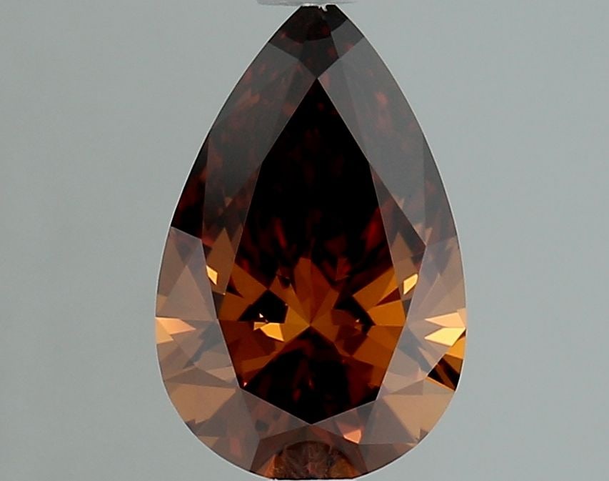 Loose Lab Diamond IGI Pear 1.02ct Fancy Deep Orange Brown VVS2: Loose Lab Diamond IGI Pear 1.02ct Fancy Deep Orange Brown VVS2 The 1.02ct loose lab-grown diamond in a pear cut has a Fancy Deep Orange Brown color and VVS2 clarity, measuring 9.06mm by 5.72mm by 3.46