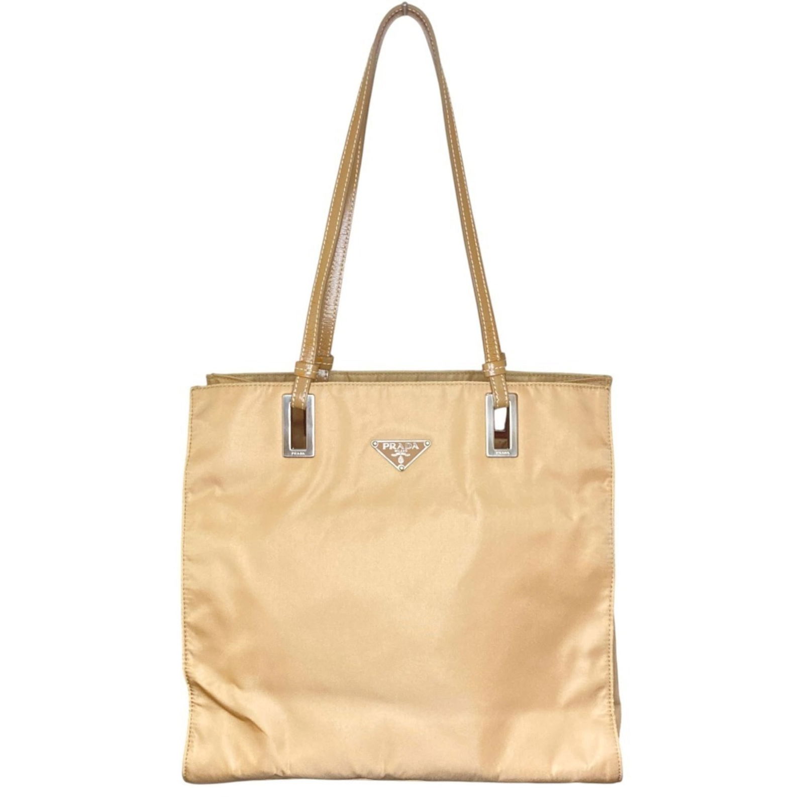 Nylon - Prada Tote Bag Leather: Nylon - Prada Tote Bag Leather This listing features Nylon - Prada Tote Bag Leather. Item specifics are provided below. Item Specifics: Brand: Prada Type: Tote Bag Material: Leather , Nylon Color: Bei