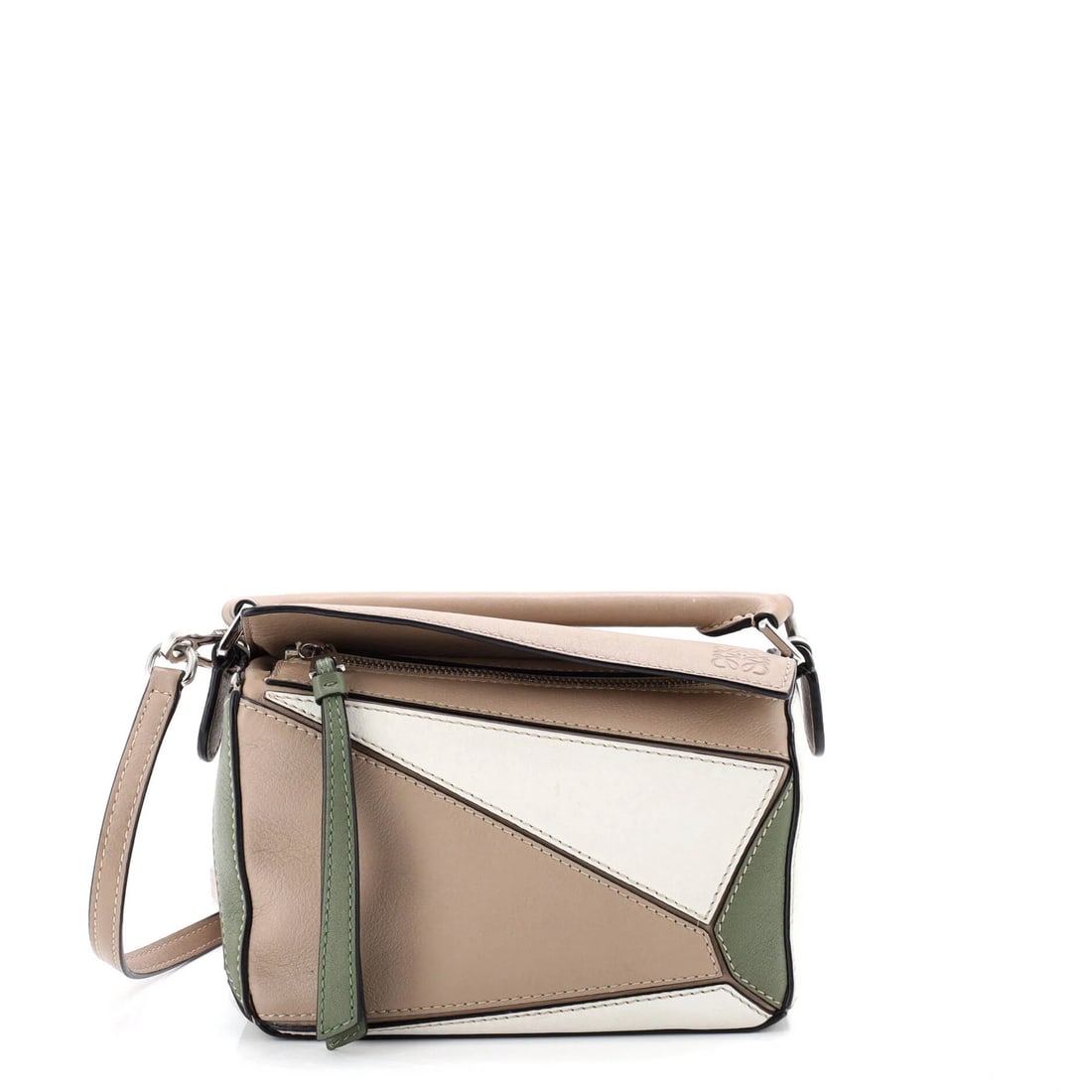 Mini Loewe Puzzle Bag Leather: Mini Loewe Puzzle Bag Leather This listing features Mini Loewe Puzzle Bag Leather. Item specifics are provided below. Item Specifics: Brand: Loewe Exterior Material: Leather Style: Cross Body Bags