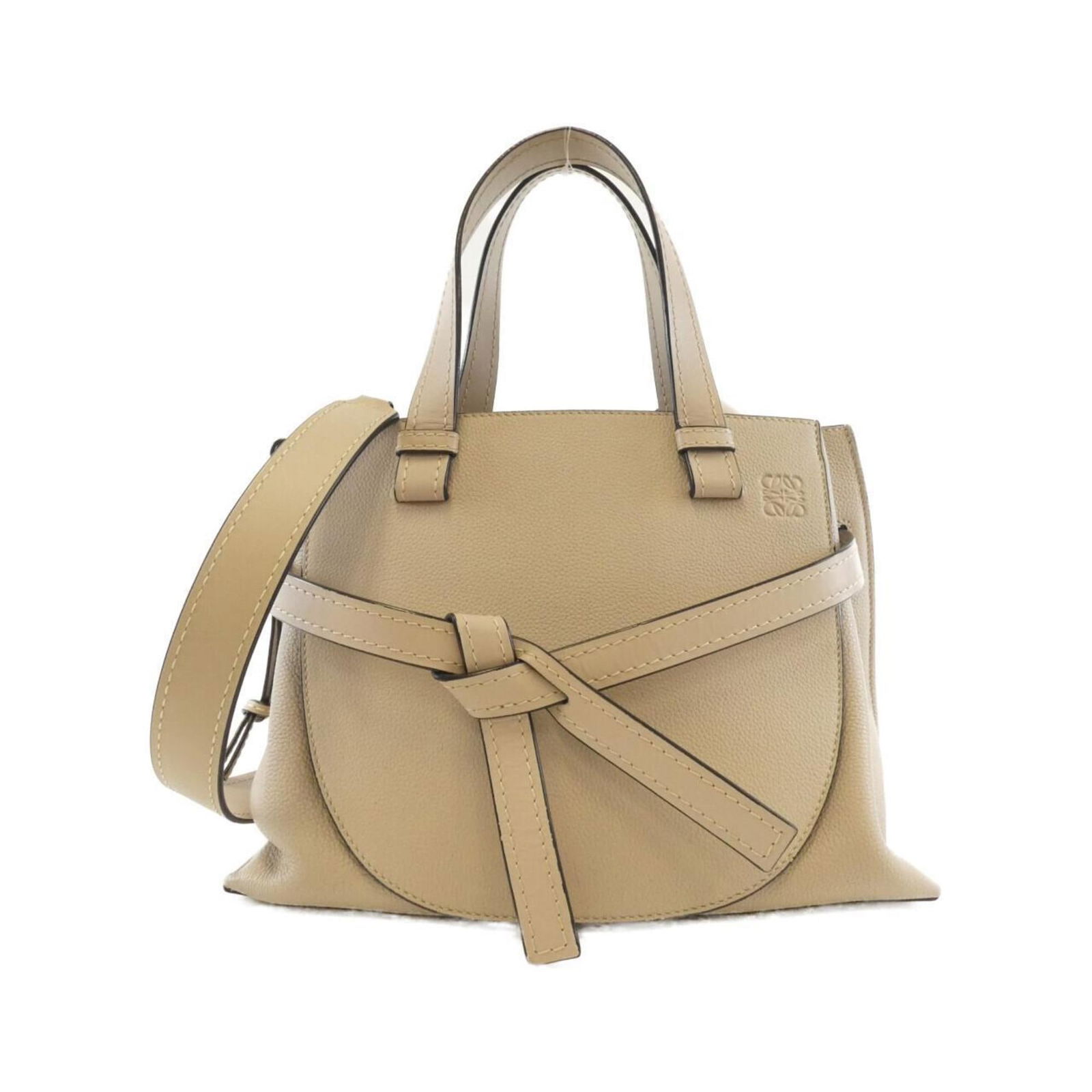 Leather Loewe Handbag: Leather Loewe Handbag This listing features Leather Loewe Handbag. Item specifics are provided below. Item Specifics: Brand: Loewe Type: Handbag Material: Leather Leather/Fur Type: Calfskin Color: Bei