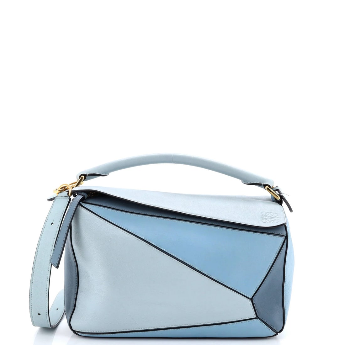 Medium Loewe Puzzle Bag Leather: Medium Loewe Puzzle Bag Leather This listing features Medium Loewe Puzzle Bag Leather. Item specifics are provided below. Item Specifics: Brand: Loewe Exterior Material: Leather Style: Shoulder Bags