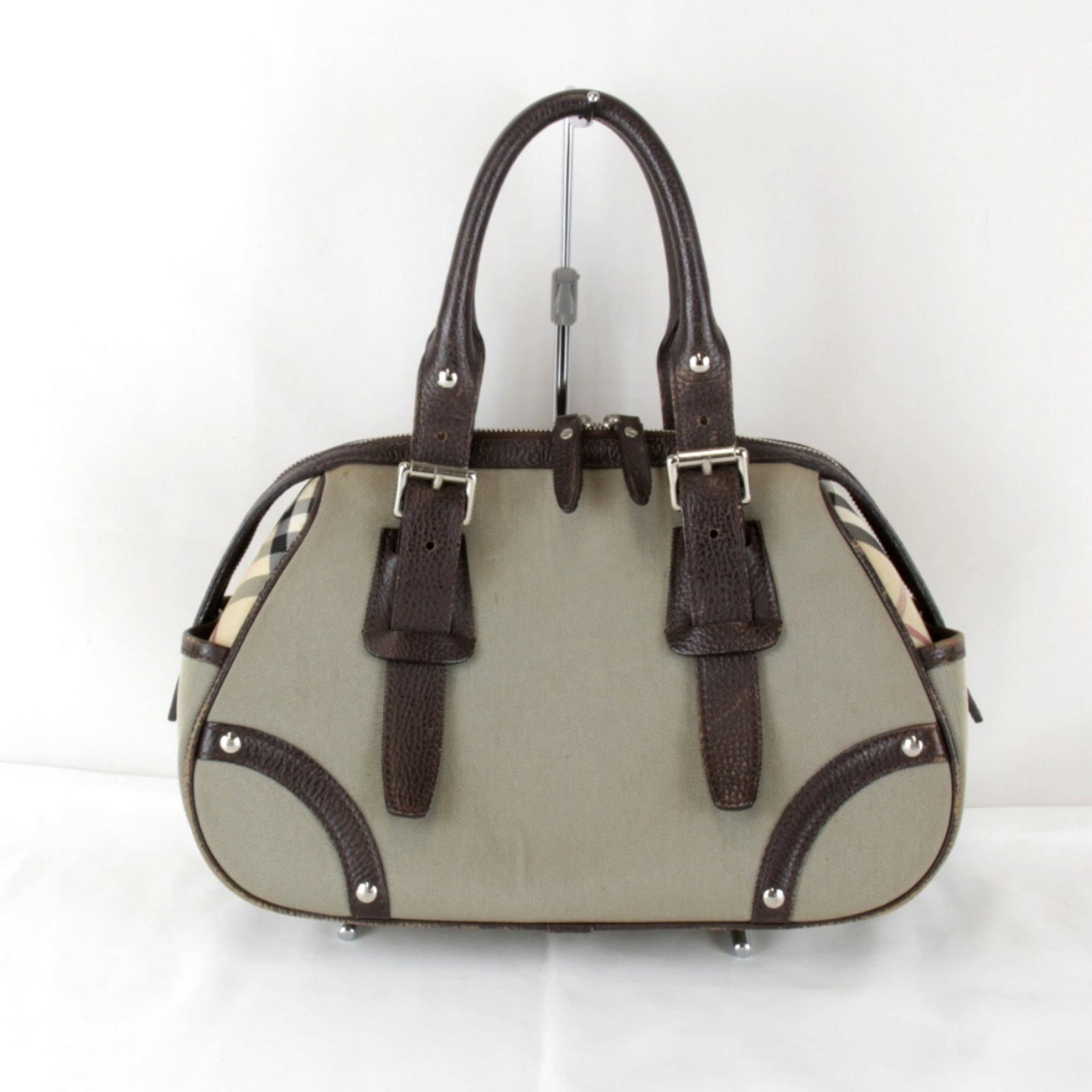 Canvas Burberry Handbag: Canvas Burberry Handbag This listing features Canvas Burberry Handbag. Item specifics are provided below. Item Specifics: Brand: Burberry Type: Handbag Material: Canvas Color: Brown Closure: Zipper Ge