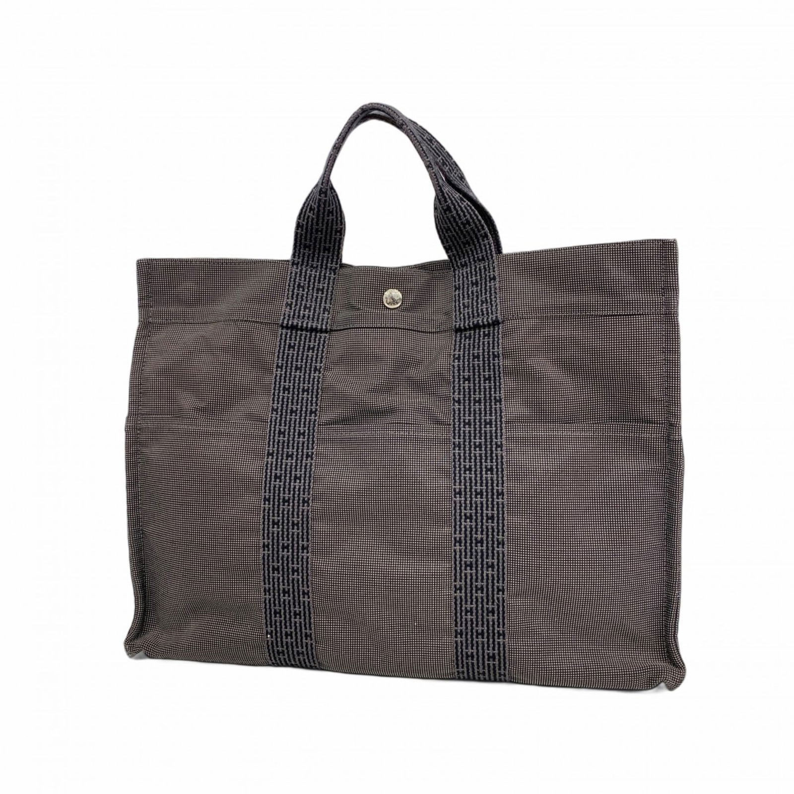 Canvas Hermes Tote Bag: Canvas Hermes Tote Bag This listing features Canvas Hermes Tote Bag. Item specifics are provided below. Item Specifics: Brand: Hermes Type: Tote Bag Material: Canvas Color: Gray Hardware Color: Silver
