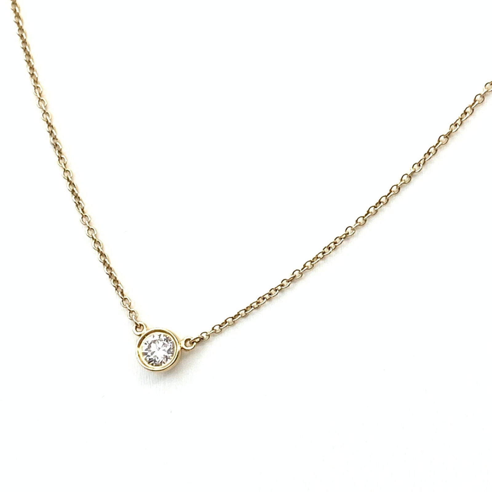 Women's - Tiffany & Co. By the Yard Necklace - Yellow Gold Pendant with Diamond - Elsa Peretti 750: Women's - Tiffany & Co. By the Yard Necklace - Yellow Gold Pendant with Diamond - Elsa Peretti 750 Diamonds This listing features Women's - Tiffany & Co. By the Yard Necklace - Yellow Gold Pendant wit