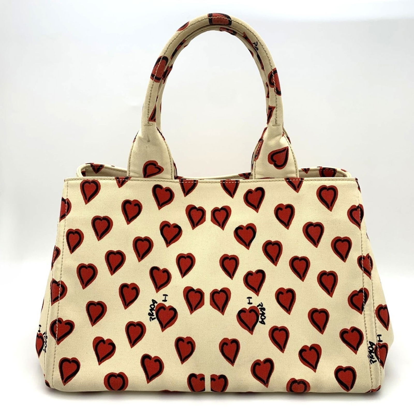 Canvas Prada Handbag: Canvas Prada Handbag This listing features Canvas Prada Handbag. Item specifics are provided below. Item Specifics: Brand: Prada Type: Handbag Material: Canvas Color: Ivory, Red Color Gender: Women Si