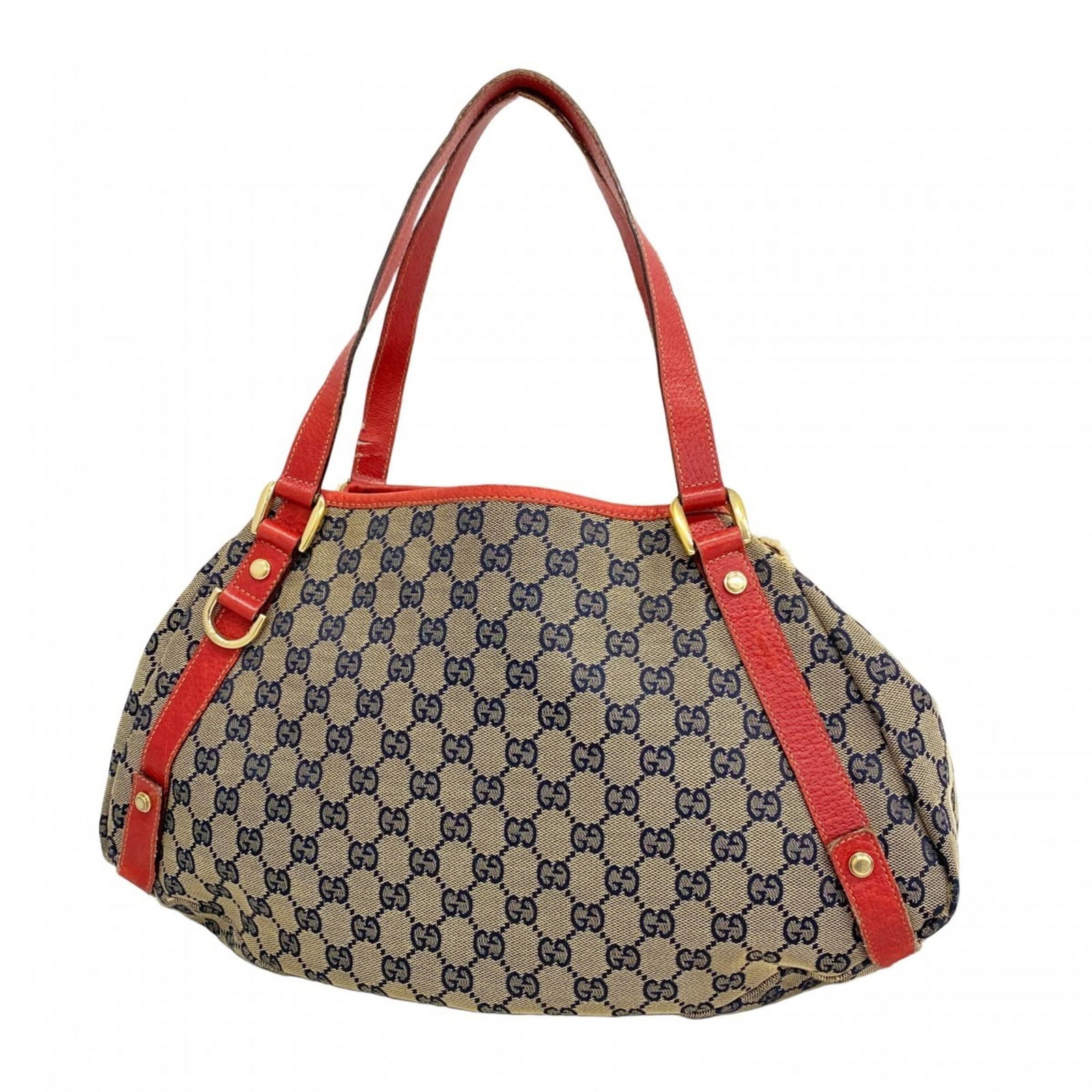 Canvas Gucci Tote Bag: Canvas Gucci Tote Bag This listing features Canvas Gucci Tote Bag. Item specifics are provided below. Item Specifics: Brand: Gucci Type: Tote Bag Material: Canvas Color: Beige, Navy, Red Color Hardwar