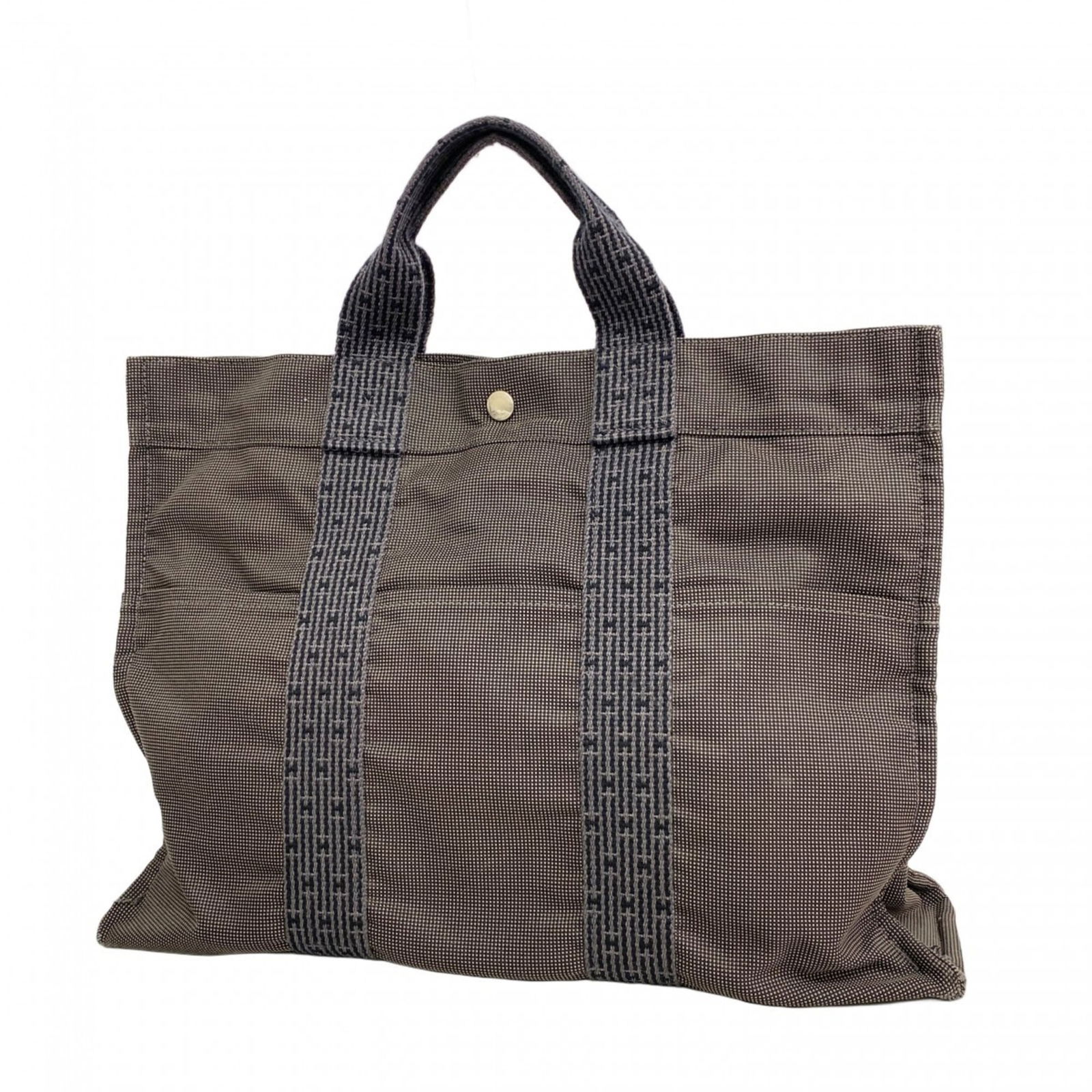 Canvas Hermes Tote Bag: Canvas Hermes Tote Bag This listing features Canvas Hermes Tote Bag. Item specifics are provided below. Item Specifics: Brand: Hermes Type: Tote Bag Material: Canvas Color: Gray Hardware Color: Silver