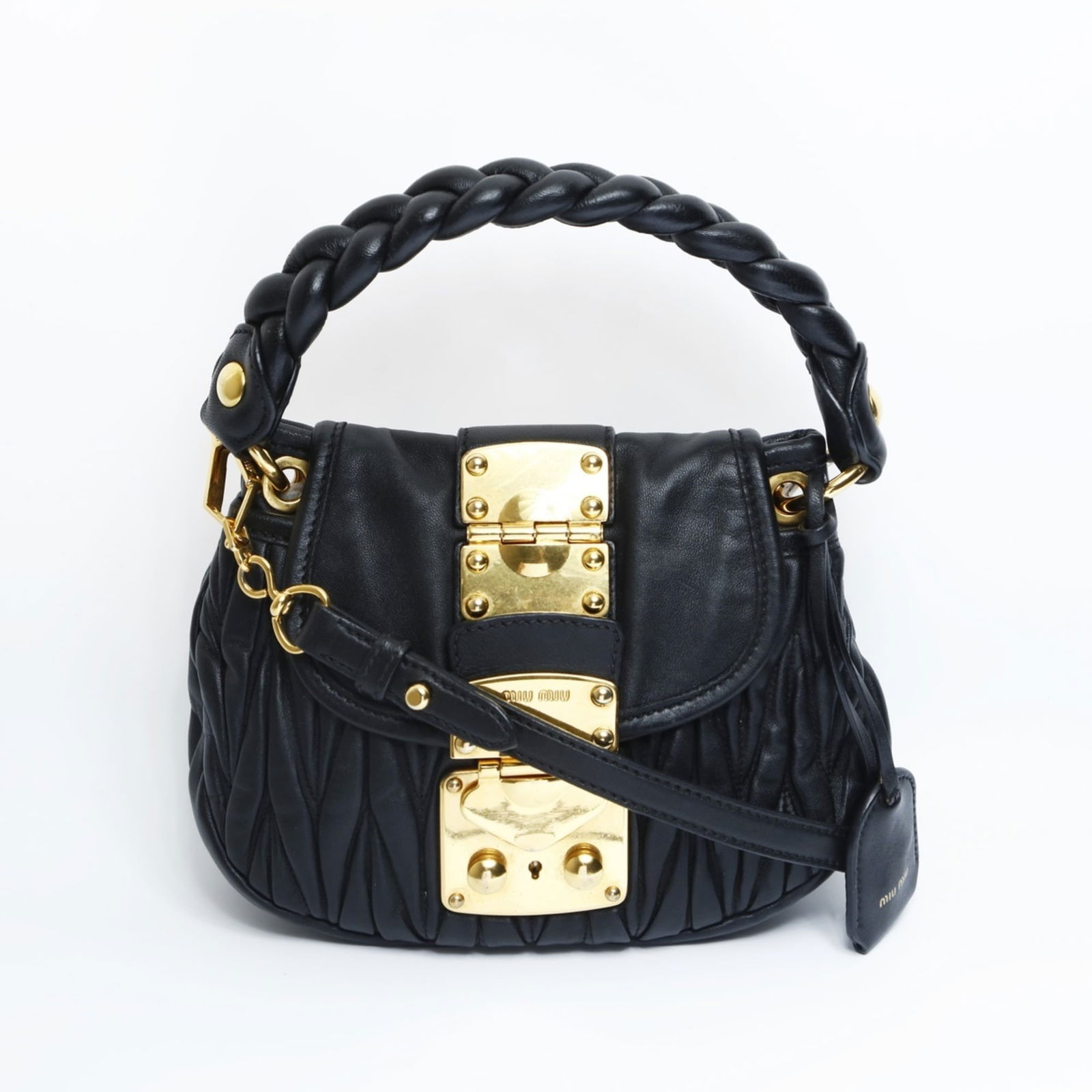 Leather Miu Handbag: Leather Miu Handbag This listing features Leather Miu Handbag. Item specifics are provided below. Item Specifics: Brand: Miu Miu Type: Handbag Material: Leather Color: Black Gender: Women Size